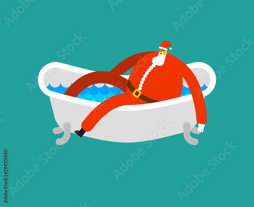Santa in bath. Klaus is relaxing in bathtub. New year and christmas grandfather