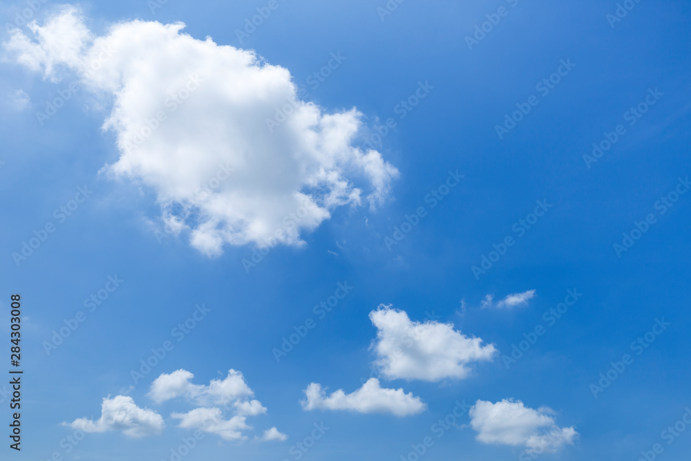 Fototapeta premium Summer blue sky, white cloud floating over clear blue sky, weather and season concept background