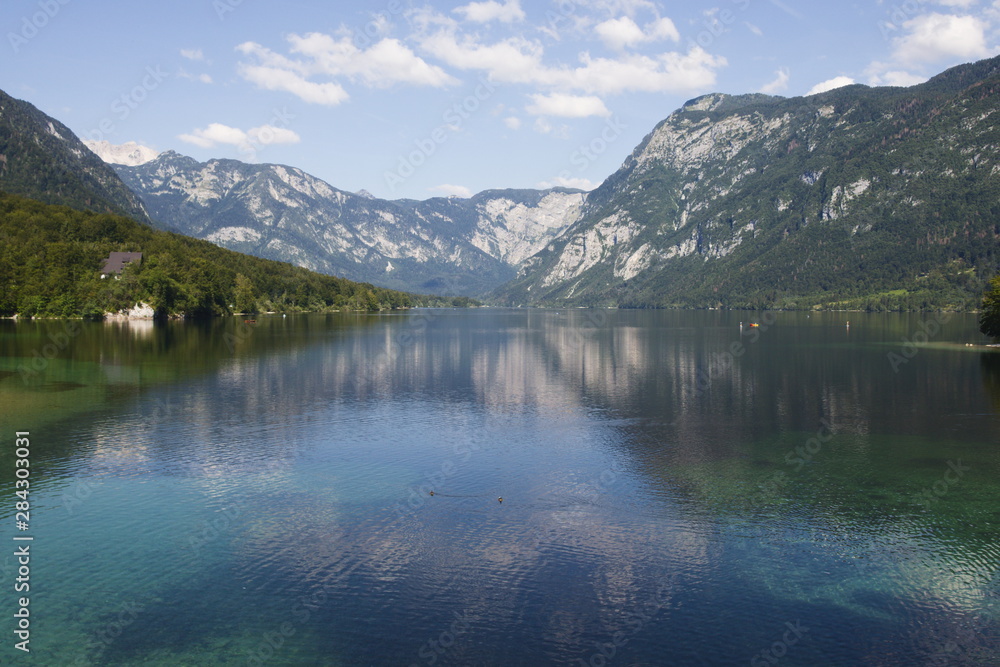 Beautiful landscape of Lake Bohinj in Slovenia with reflections of the mountains