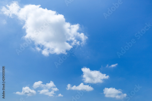 Summer blue sky  white cloud floating over clear blue sky  weather and season concept background