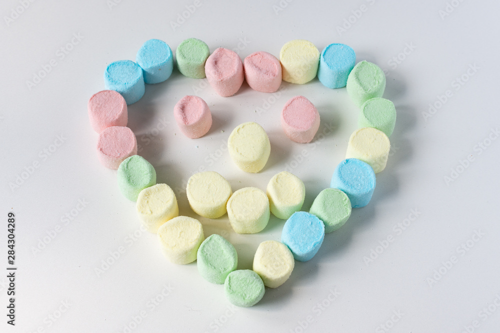 Sweet heart made of marshmallows on a white background. Marshmallow figures. Sweet heart made of marshmallows on a white background. Marshmallow figures.