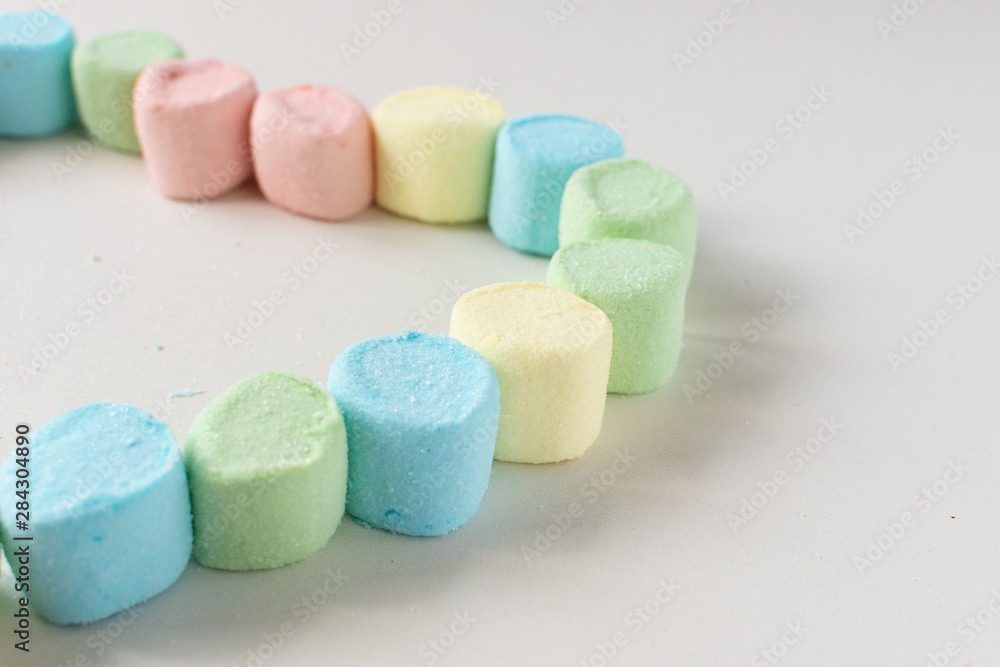 Sweet heart made of marshmallows on a white background. Marshmallow figures. Sweet heart made of marshmallows on a white background. Marshmallow figures.