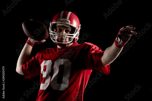 American football player throwing rugby ball