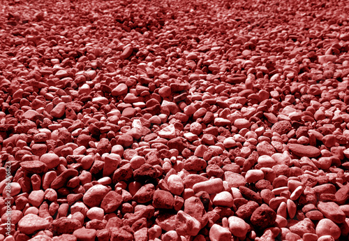 Pile of small gravel stones in red tone.