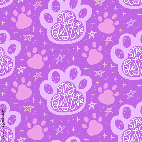 Stay Pawsitive lettering in paw print, monochrome purple seamless pattern