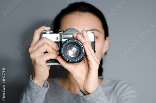 young woman with a camera