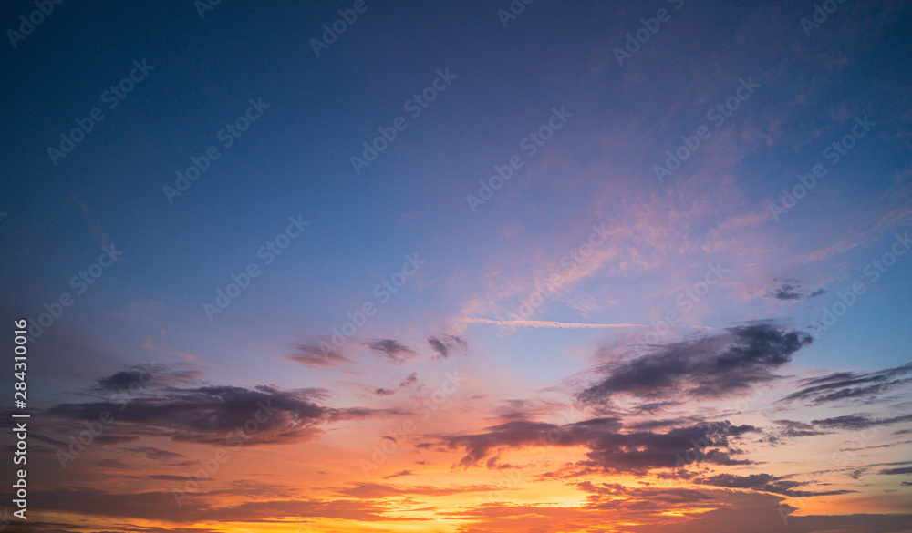 Sunset sky with tiny clouds nature background.