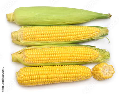 Collection corn with skin or without skin isolated on white background. Top view, flat lay