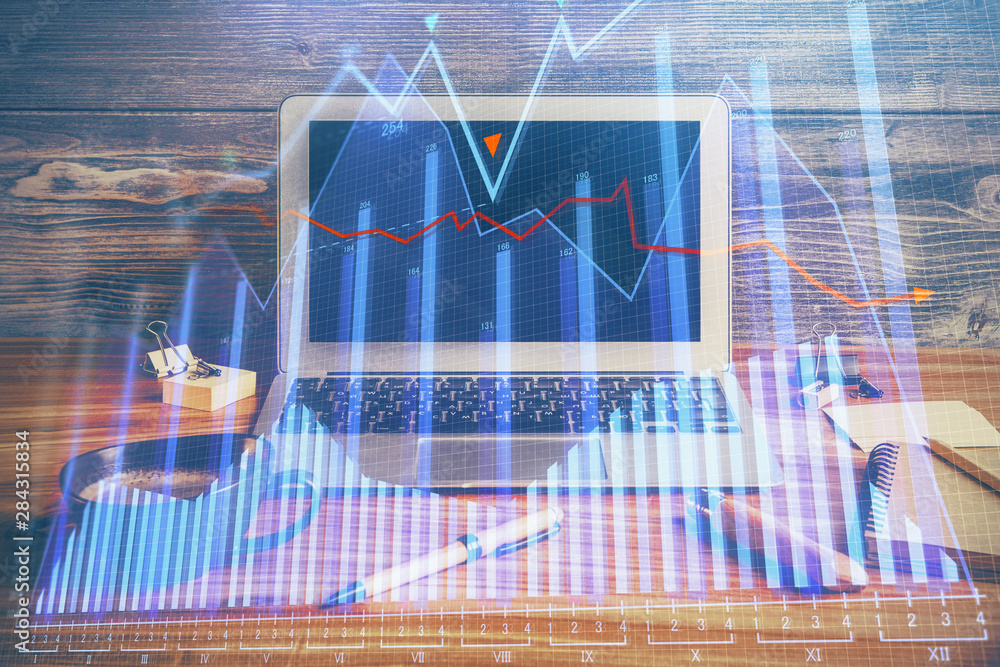 Double exposure of forex graph and work space with computer. Concept of international online trading. Double exposure of forex graph and work space with computer. Concept of international online trading.