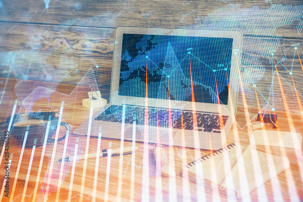 Double exposure of chart and financial info and work space with computer background. Concept of international online trading. Double exposure of chart and financial info and work space with computer background. Concept of international online trading.