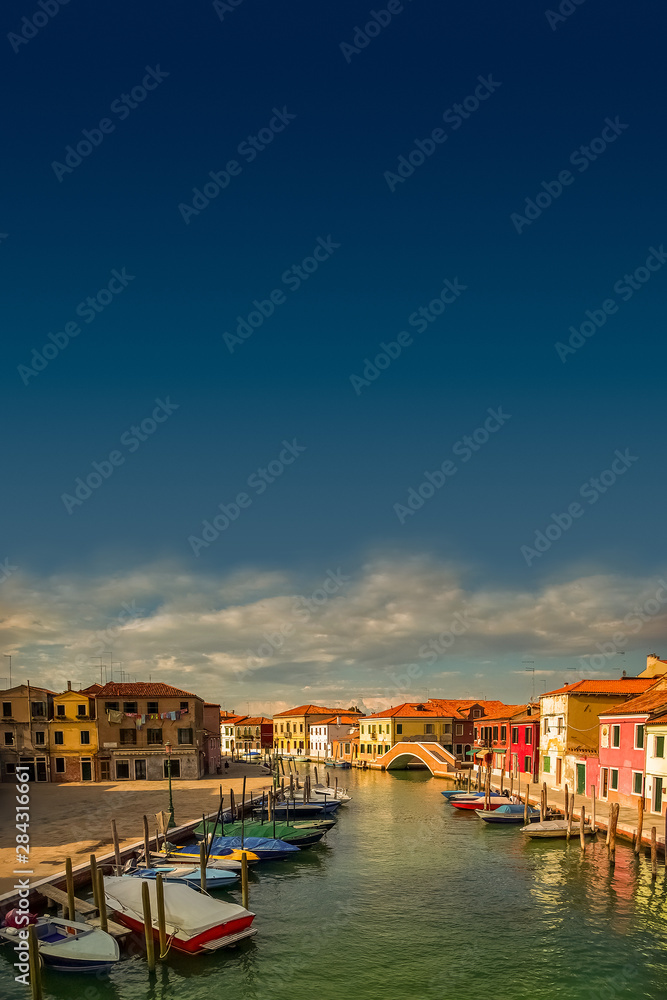Beautiful island near Venice Murano at sunset and blue dark sky, Venice, Italy, summer