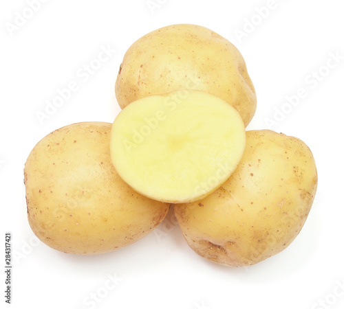 Young potato and half isolated on white background. Harvest new. Flat lay, top view