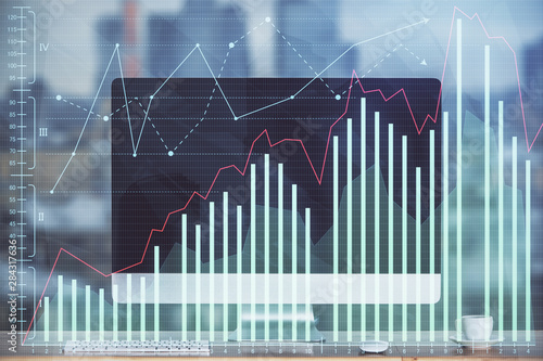 Financial graph colorful drawing and table with computer on background. Double exposure. Concept of international markets. © peshkova