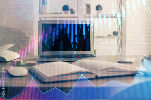 Financial market graph hologram and personal computer on background. Double exposure. Concept of forex. © peshkova