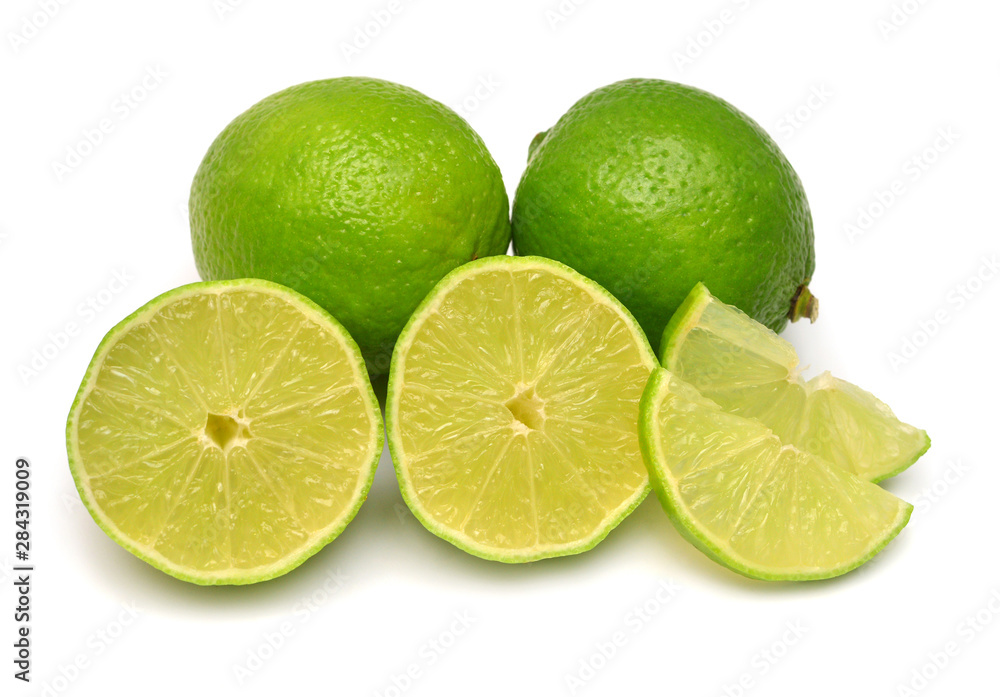 Lime fruit whole, half and slices isolated on a white background. Creative juice concept. Flat lay, top view