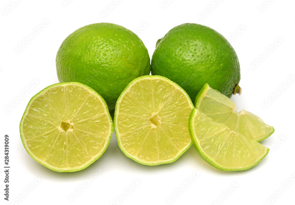 Lime fruit whole, half and slices isolated on a white background. Creative juice concept. Flat lay, top view Lime fruit whole, half and slices isolated on a white background. Creative juice concept. Flat lay, top view
