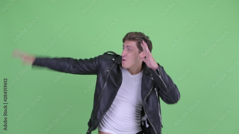 Happy young rebellious man dancing Happy young rebellious man dancing