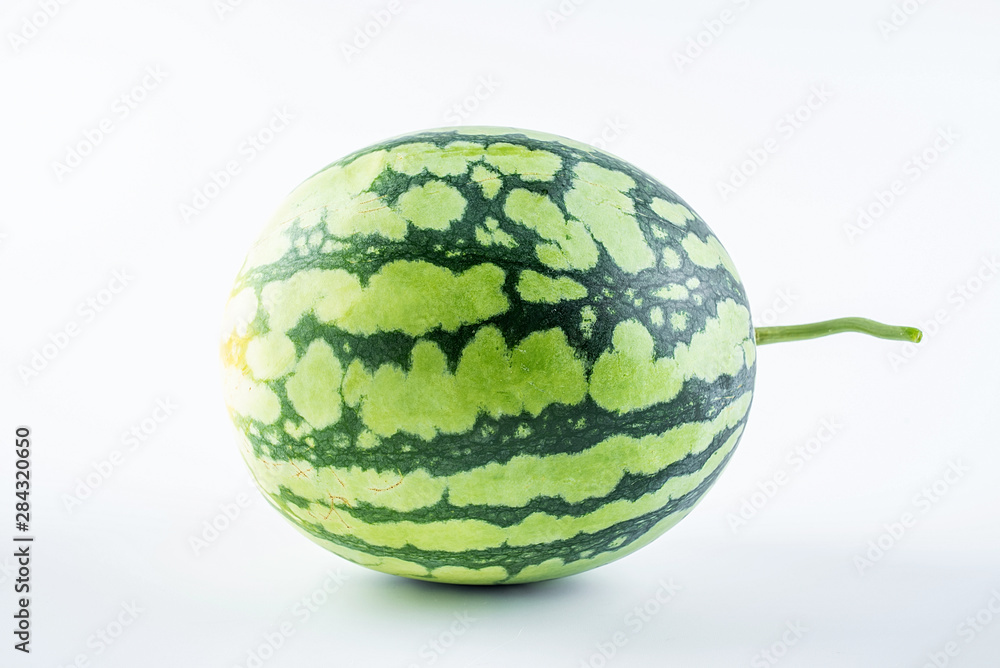 One watermelon with fresh fruits on white background One watermelon with fresh fruits on white background
