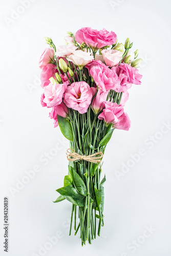 A bouquet of flowers eustoma on a white background © Lili.Q