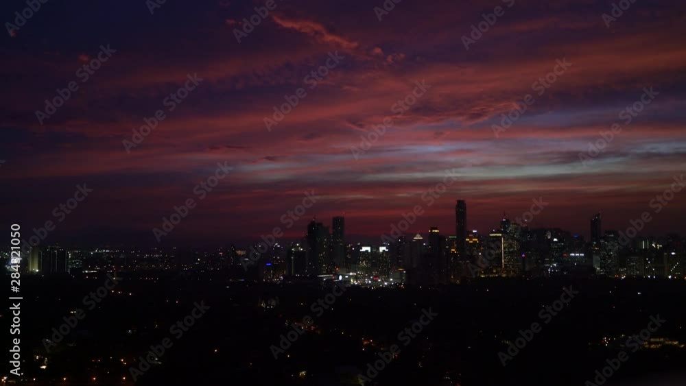 Manila Skyline - Colorful sky during dusk in Makati neighborhood in the capital of the Philippines Manila Skyline - Colorful sky during dusk in Makati neighborhood in the capital of the Philippines
