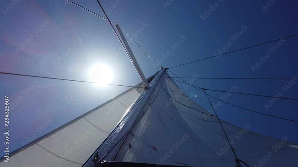 Sailing in the wind. Full sails, very strong wind. Madeira island, Portugal. Sailing in the wind. Full sails, very strong wind. Madeira island, Portugal.