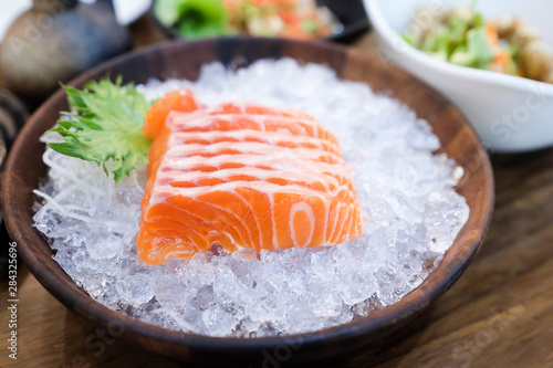 Fresh salmon on ice with vegetable for eating 