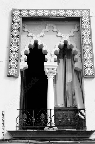 Fototapeta Naklejka Na Ścianę i Meble -  Window in Cordoba, Spain. Black and white vintage style.