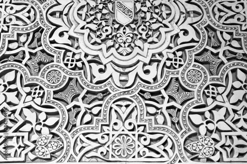 Alhambra decorations stonework in Spain. Black and white vintage style.