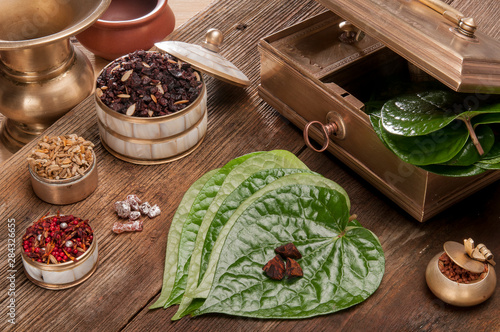 Paan leaf and betel nut photo