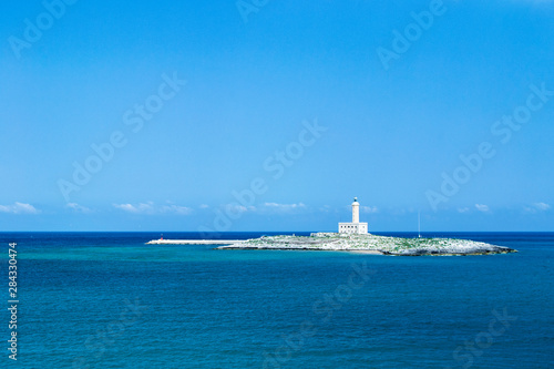 Vieste, Gargano, Apulia. lighthouse on the island in the middle of the bay. Mediterranean sea © giodilo