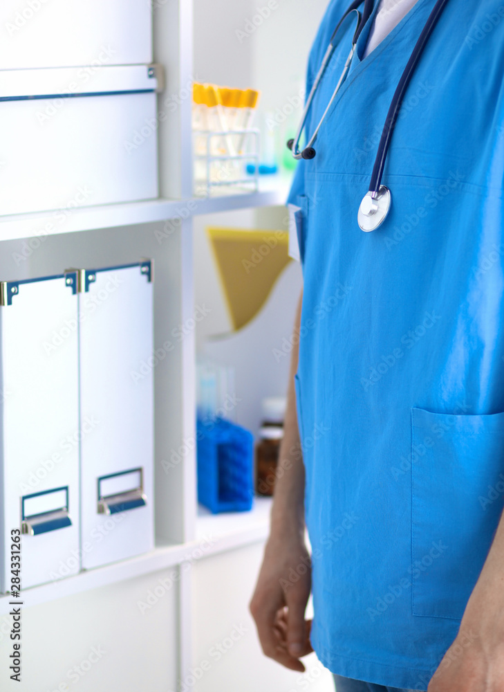 Closeup portrait of a doctor with stethoscope holding folder Closeup portrait of a doctor with stethoscope holding folder