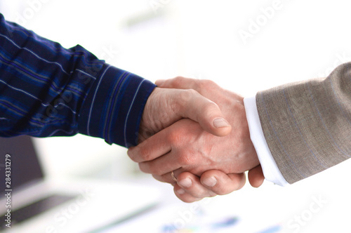 Business handshake. Two businessman shaking hands with each oth photo