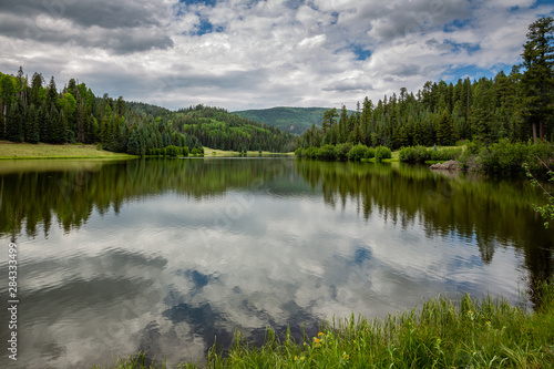 Hurricane Lake reflects the sky in the back country of the White Mountains of east central Arizona.