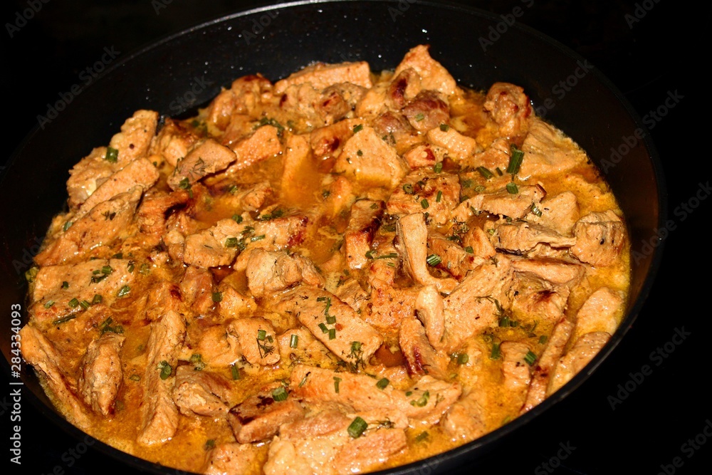 stew in your own juice meat in a pan close-up stew in your own juice meat in a pan close-up