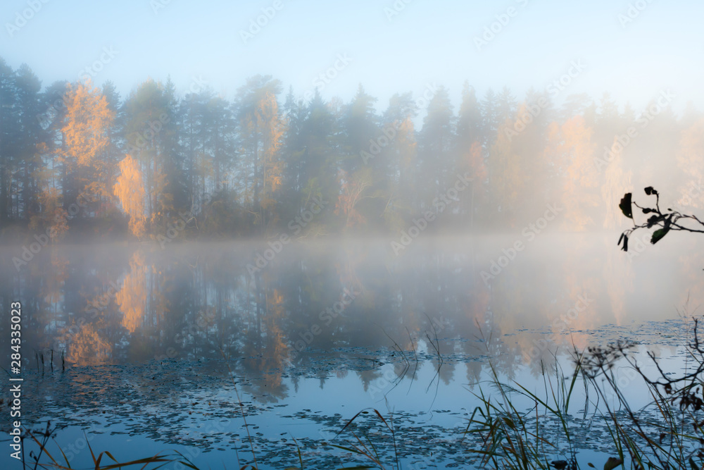 Beautiful autumn morning landscape of Kymijoki river waters in fog. Finland, Kymenlaakso, Kouvola.