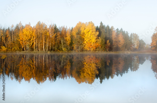 Beautiful autumn morning landscape of Kymijoki river waters in fog. Finland, Kymenlaakso, Kouvola.