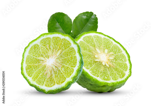 A half of bergamot or kaffir with leaf isolated on white background.