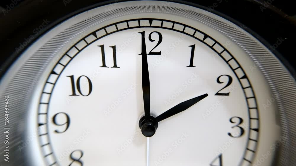 The Clock With Black Arrows Shows The Time Two Hours Timelapse. The Clock With Black Arrows Shows The Time Two Hours Timelapse.
