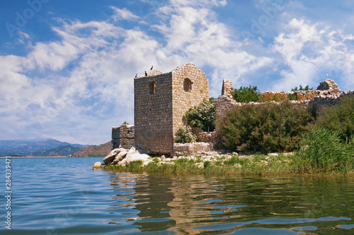 Wallpaper Mural Picturesque lake with ruined fort on small island. View of National Park Lake Skadar and Fortress Grmozur on sunny summer day. Montenegro Torontodigital.ca