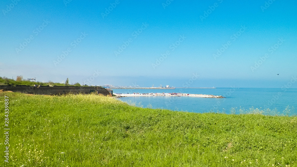 View from cliff on water of Black Sea. Beautiful transparent water of Black Sea, exploration and nature concept, Romania, Dobrogea region