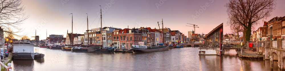 Cityscape, panorama, banner - view of city channel with ships, the city of Leiden, Netherlands.