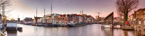 Cityscape, panorama, banner - view of city channel with ships, the city of Leiden, Netherlands. photo
