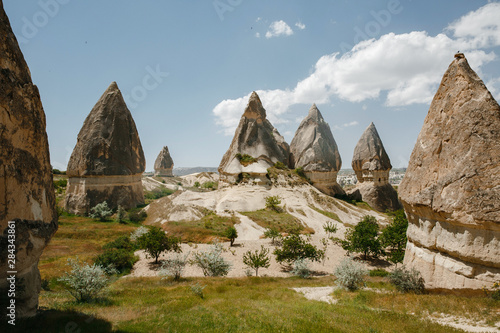 Love valley in Goreme village, Turkey. Rural Cappadocia landscape. Stone houses in Goreme, Cappadocia. Countryside lifestyle.