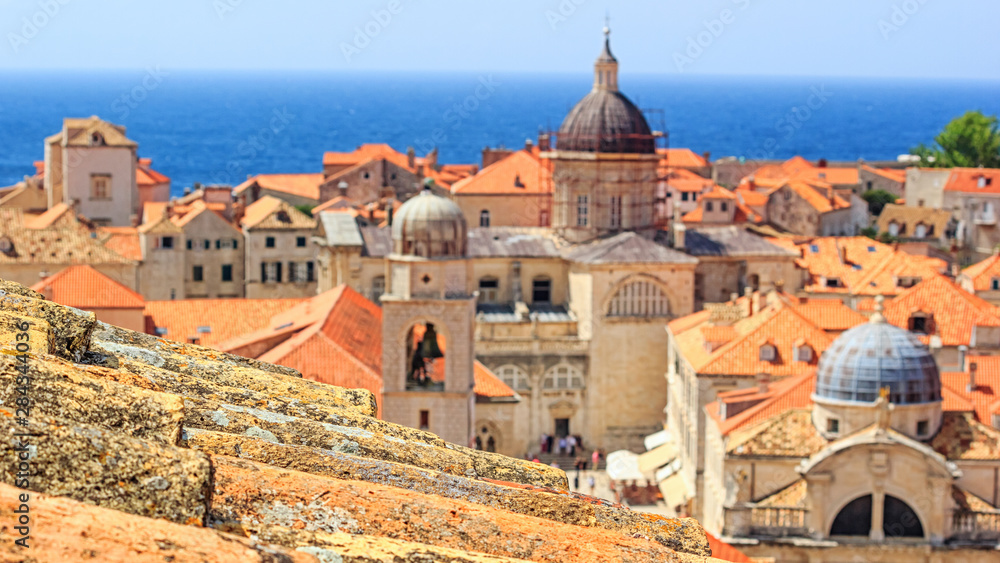 Summer mediterranean cityscape - view of the old roof on the background of the Old Town of Dubrovnik on the Adriatic coast of Croatia, closeup