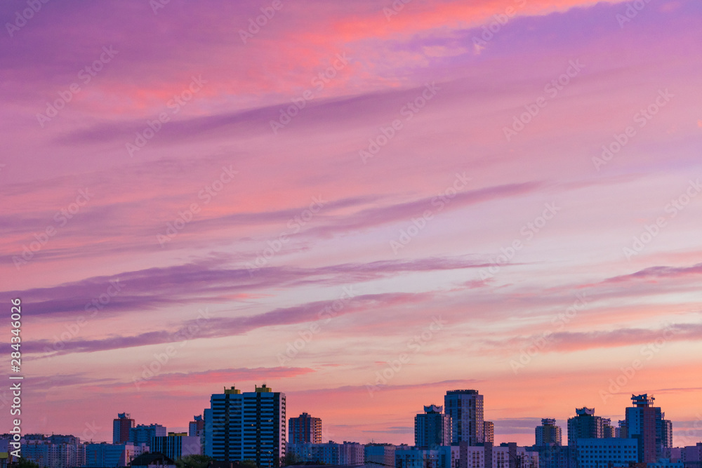 Fototapeta premium Sunset in the city, sky with clouds