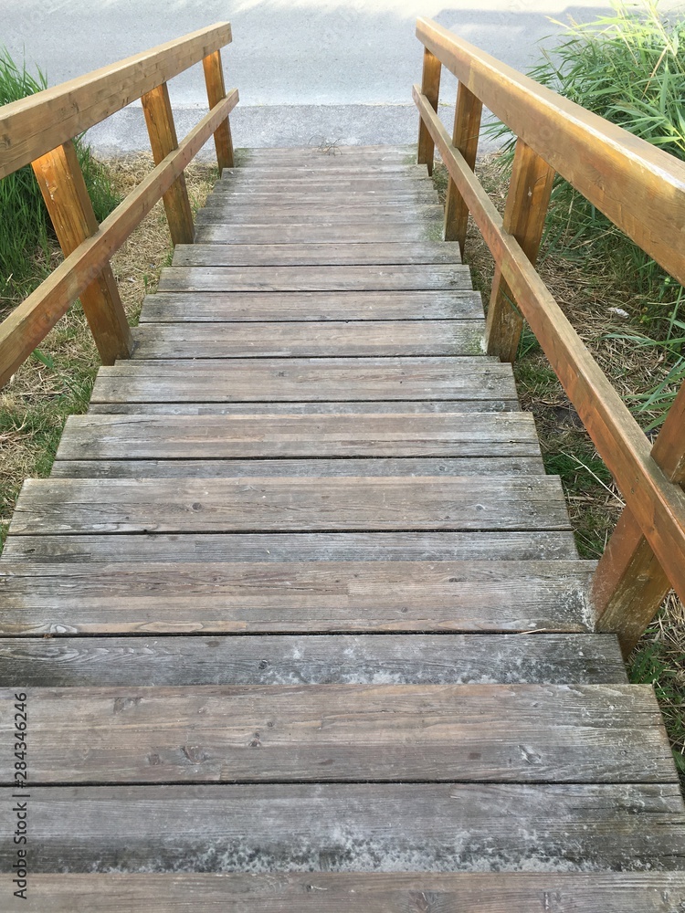 GERMANY, Holztreppe an einem Deich