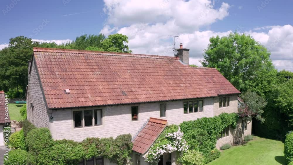 Rising Aerial Shot of a Large Family Home revealing Rural Surroundings Rising Aerial Shot of a Large Family Home revealing Rural Surroundings