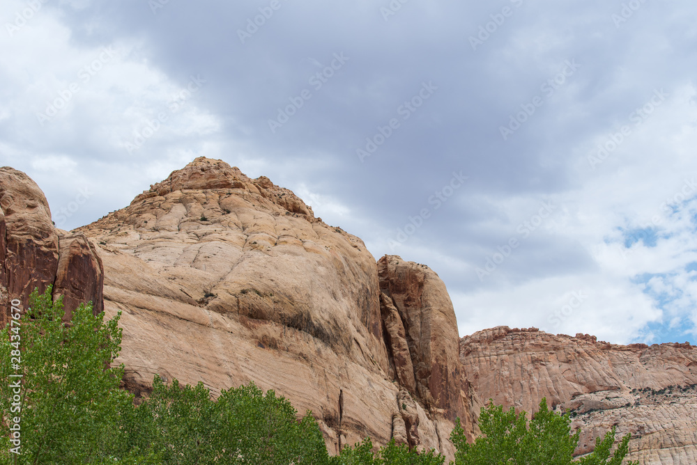 Fototapeta premium Capitol Reef National Park low angle landscape of massive white stone mountains