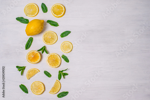 background with lemon slices and mint leaves beautifully laid out