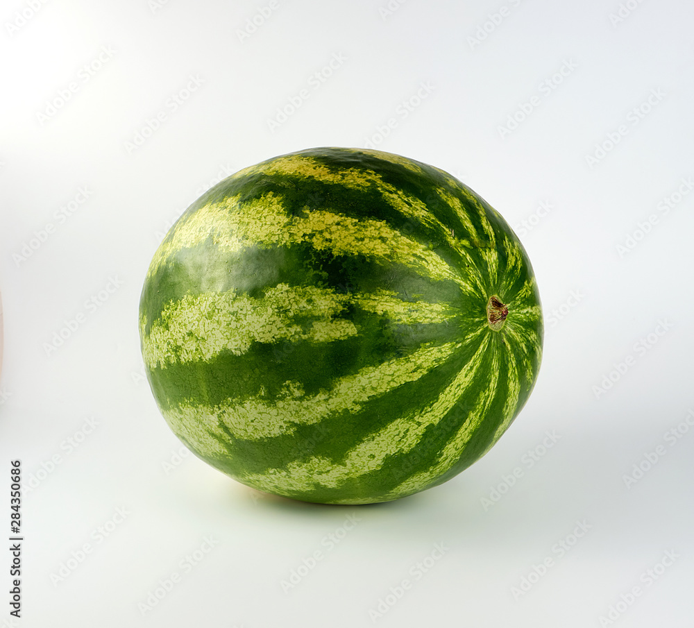 big green striped whole watermelon on a white background big green striped whole watermelon on a white background